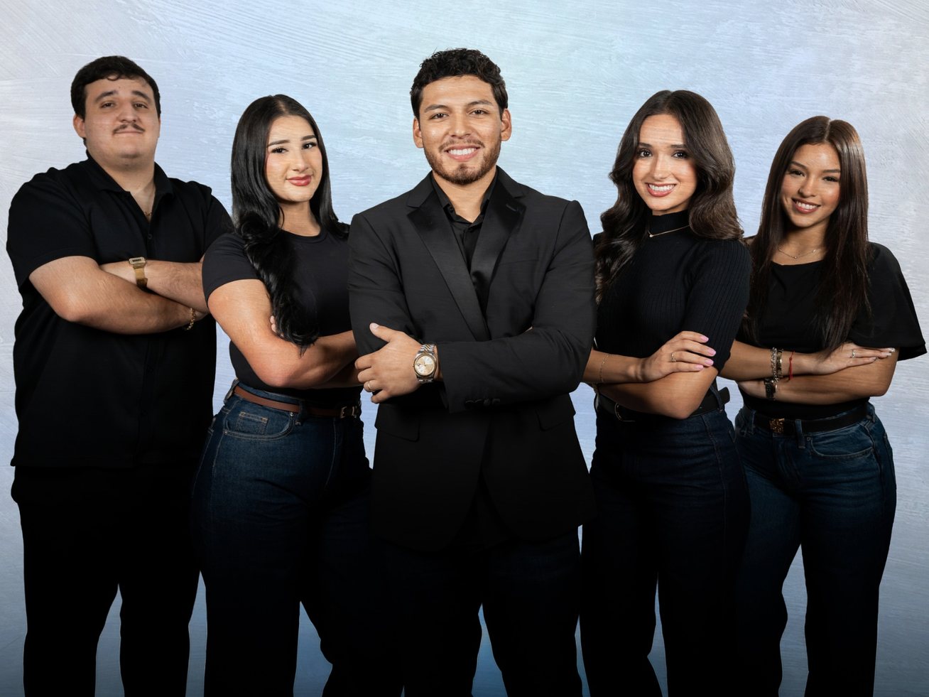 Five members of the WeSell It team standing together